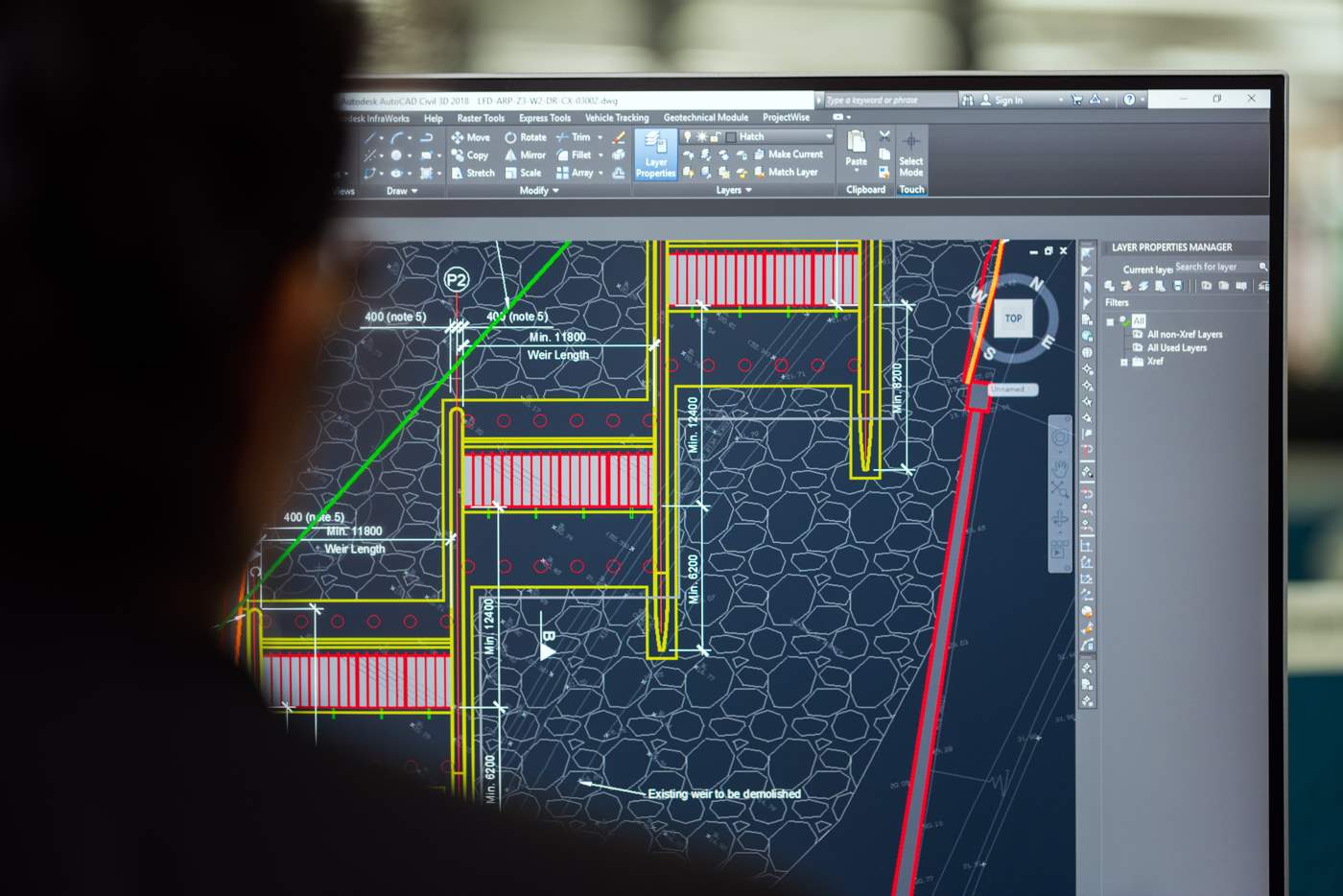 View over someone's shoulder of a screen with an engineering drawing on it
